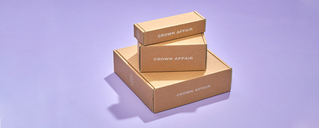 crown affair cardboard boxes on purple background