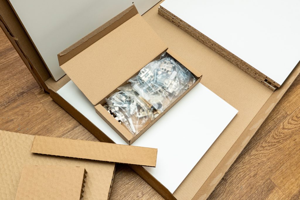 furniture packaging with plastic bags holding screws