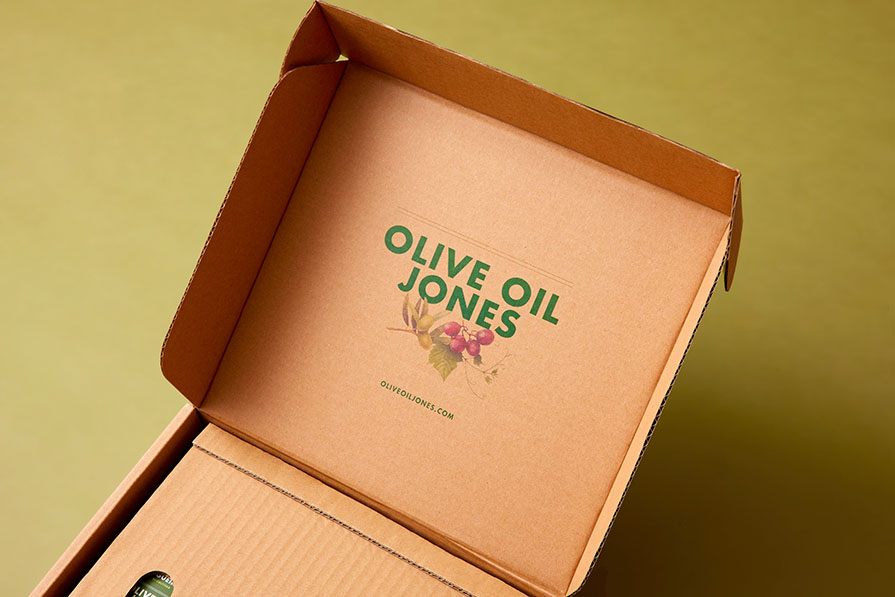 Olive Oil Jones package opened showing the company's logo