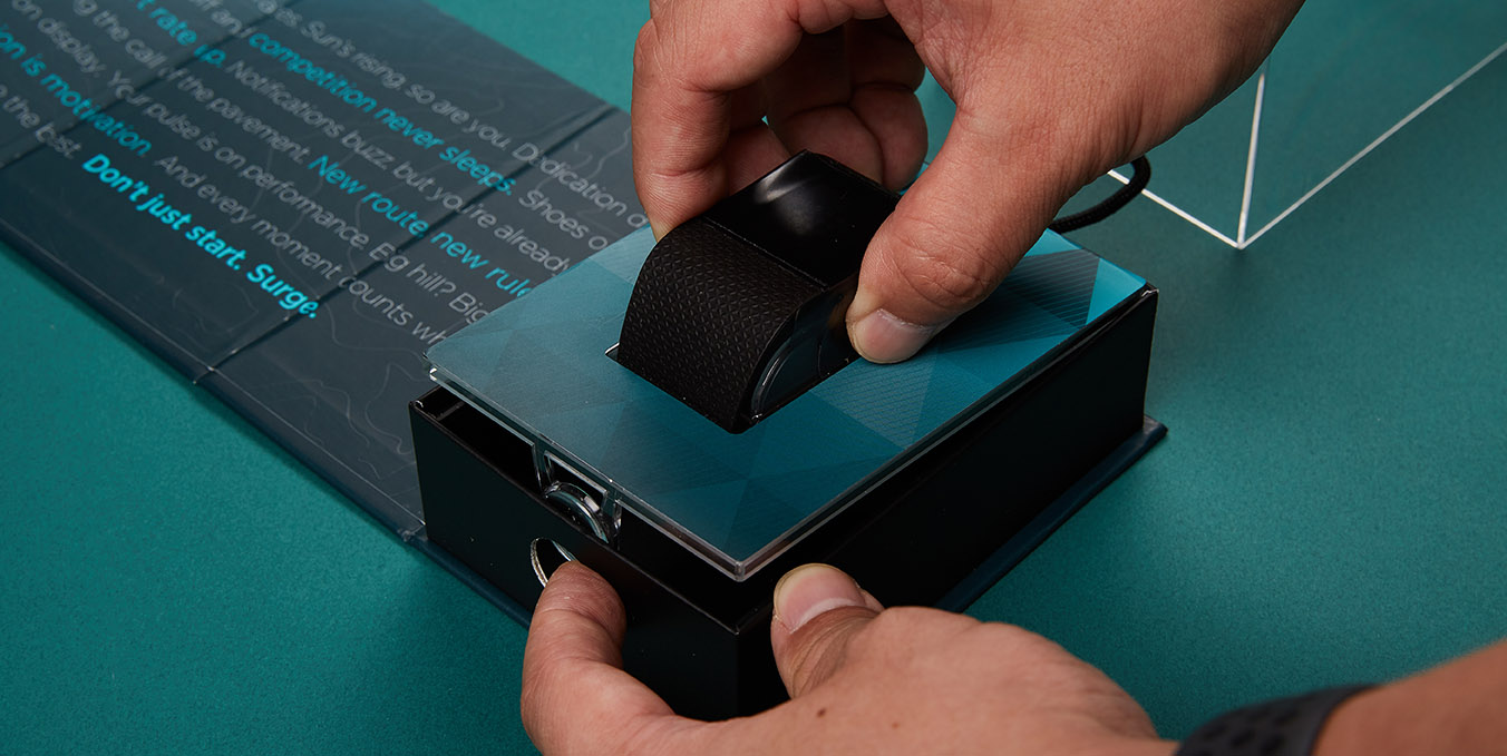 Fitbit smartwatch being placed in the packaging