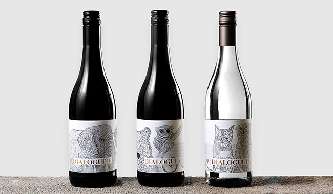 Three wine bottles with intricate animal illustrations for DIALOGUE16's packaging mockup