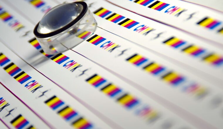 Magnified view of CMYK packaging inks calibration strip for quality printing
